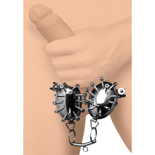 Master Series Scrotum Egg Shells with Spikes shown in use, stainless steel scrotal restraint