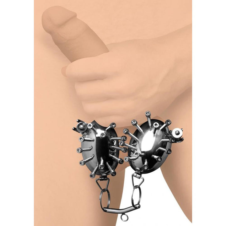 Master Series Scrotum Egg Shells with Spikes shown in use, stainless steel scrotal restraint