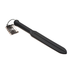 Master Series Stung Silicone Tawse lying flat, showing full black silicone paddle and ribbed handle