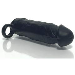 Meaty Cock Extender lying flat, showing textured exterior surface and stretchy base ring