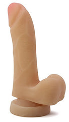 Mighty Mike realistic beige dildo standing upright on suction base showing full shaft profile