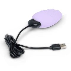 Mimi Deux clitoral vibrator connected to black USB magnetic charging cable