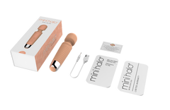 Mini Halo wand massager with box, USB charging cable, and included instruction cards laid flat