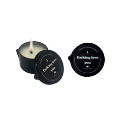 Mini pour-spout massage candle open beside its lid, revealing white soy wax with lit flame
