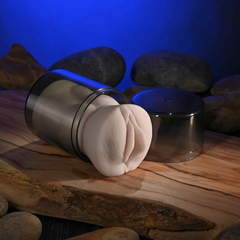 Mini stroker partially inserted in dark travel canister with lid set aside
