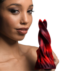 Model holding Hell Kiss twisted tongues dildo, showcasing its spiral red and black silicone form