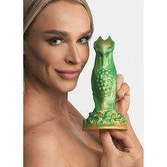 Model holding Nebula Alien Silicone Dildo showing green sculptural alien creature form