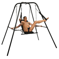 Model using Throne sex swing with wrist cuffs attached, demonstrating open stirrup leg positioning