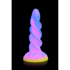 Moon Rider unicorn dildo glowing blue and pink in the dark on black background