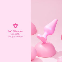 Multiple B-Mine plugs arranged on pink surface highlighting soft silicone finish
