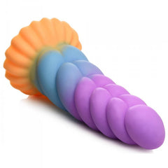 Mystique unicorn dildo laying flat showing textured beaded underside and scalloped base