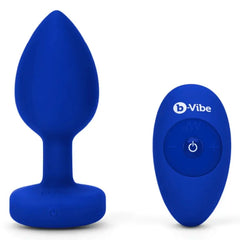 Navy blue silicone jewel plug and oval wireless remote control shown out of box