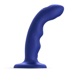 Night blue Strap-On-Me Wave dildo with curved shaft and wavy texture, side profile view