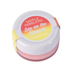 Nipple Nibblers cocktail balm in closed white pot with gradient sunset-toned label