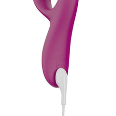 Close-up of Nova 2 base with white magnetic charging cable attached to fuchsia silicone body