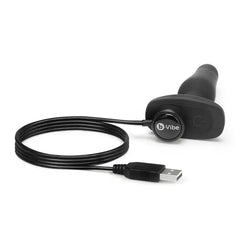 Novice Plug lying flat connected to magnetic USB charging cable for rechargeable use