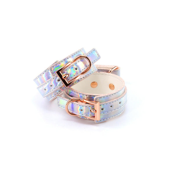 NS Novelties Cosmo Bondage ankle cuffs in holographic rainbow faux leather with rose gold buckles