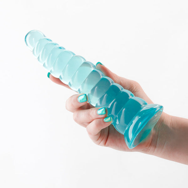 NS Novelties Fantasia Nymph Teal dildo held in hand, showing ribbed spiral shaft and suction base
