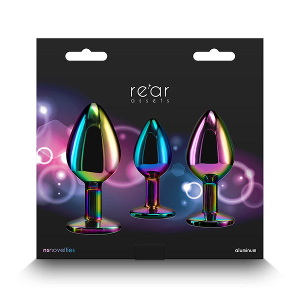 NS Novelties Rear Assets rainbow plug set displayed in dark retail box, three sizes shown