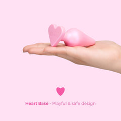 Open palm displaying B-Mine heart base plug showing playful heart base design