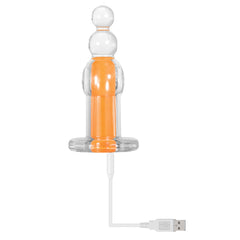 Orange Dream plug connected to white USB magnetic charging cable at the base