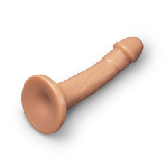 Overhead diagonal view of 8-inch realistic dildo displaying shaft length and wide flat suction base
