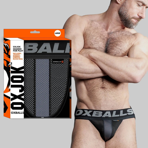 OXBALLS AIRMESH Swagger Jockstrap in tar black with bold branded waistband, worn by male model