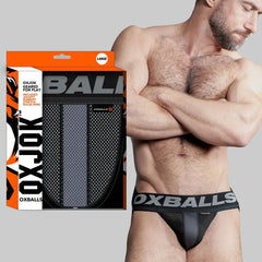 OXBALLS AIRMESH Swagger Jockstrap in tar black with bold branded waistband, worn by male model