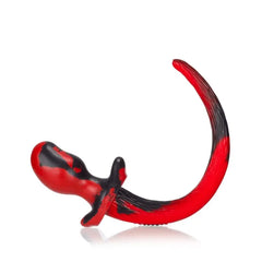 Close-up of Oxballs Beagle medium plug showing marbled red and black silicone texture