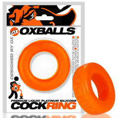 Oxballs Cock-T Cock Ring in orange displayed beside its branded retail packaging for scale