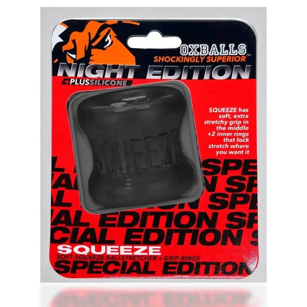 Oxballs Squeeze Ball Stretcher Night Edition in black silicone, shown in retail packaging