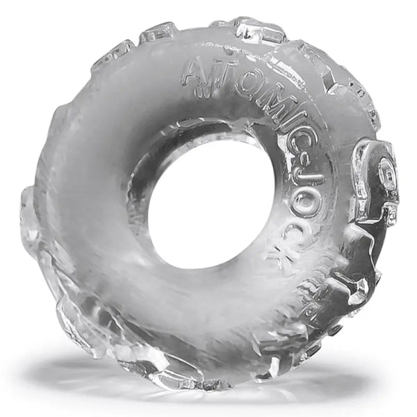 Oxballs Jelly Bean cock ring in clear, showing textured tread-pattern exterior and flexible TPR construction