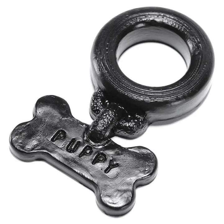 Oxballs Puppy Silicone Cockring in black with embossed bone-shaped charm tag