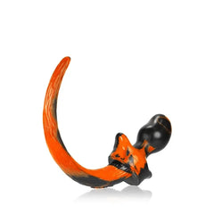 Close-up of Oxballs Puppy Tail plug showing swirled silicone texture and flexible arching tail