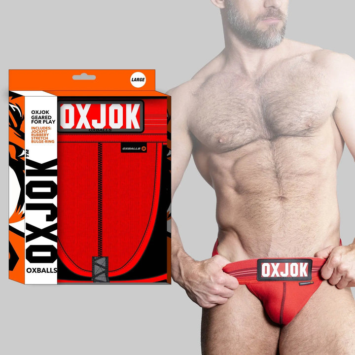 OXBALLS SLINGJOCK red jock with bold waistband label, shown with retail packaging