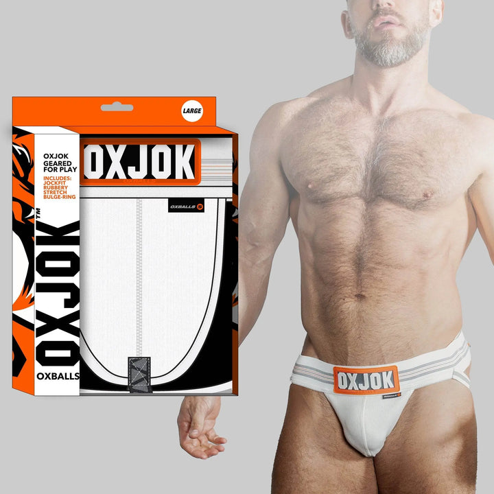 OXJOK Slingjock white jockstrap with orange logo waistband, shown with retail packaging