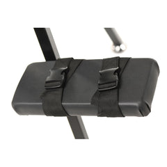 Close-up of padded arm or leg support cushion secured by adjustable quick-release strap buckles
