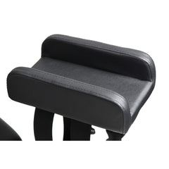 Close-up of padded leg rest cushion upholstered in black faux leather with integrated nylon strap