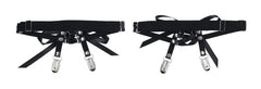 Pair of black elastic leg garters with dual metal stocking clips and decorative ribbon bows