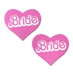 Pastease Bride pink heart-shaped pasties, pair shown flat, white retro doll-style lettering