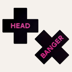 Pastease Head Banger black cross pasties with neon pink text, shown as a pair