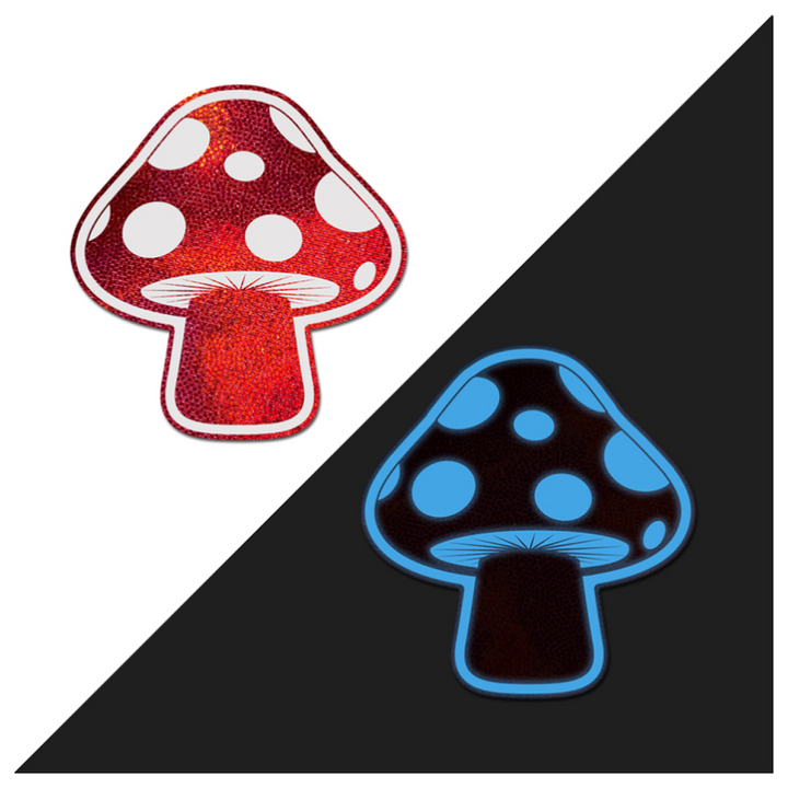 Pastease red holographic mushroom pasties shown normally and glowing blue in the dark