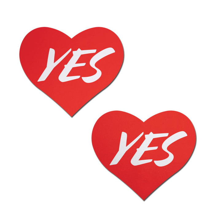 Pastease YES Red Heart Nipple Pasties pair, bold white script on vibrant red hearts