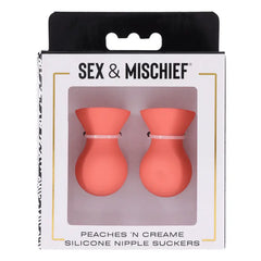 Peaches N CreaMe Silicone Nipple Suckers in retail box, front window displaying coral-toned pair