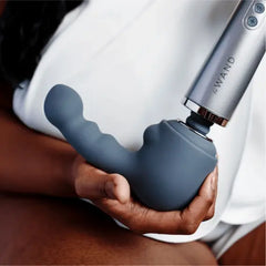 Person holding Le Wand wand with Ripple attachment connected, lifestyle context
