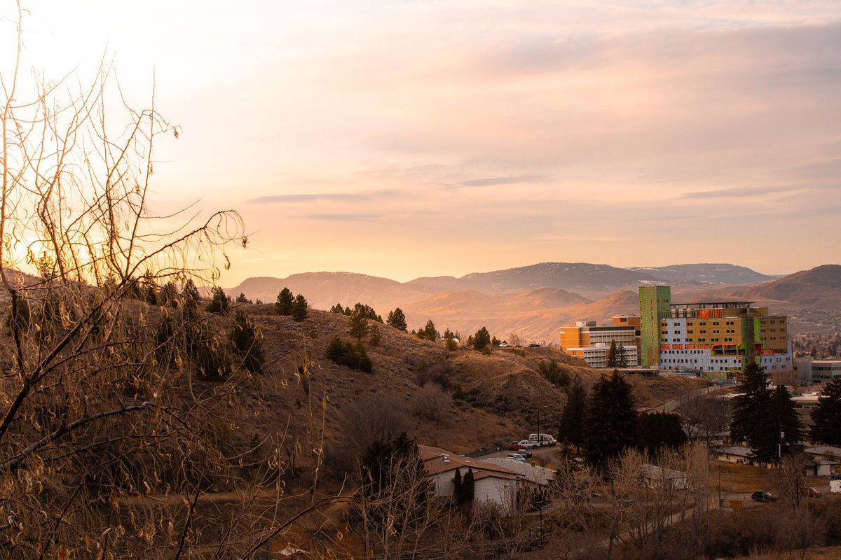 Sunset over the hillside homes and buildings of Kamloops, British Columbia