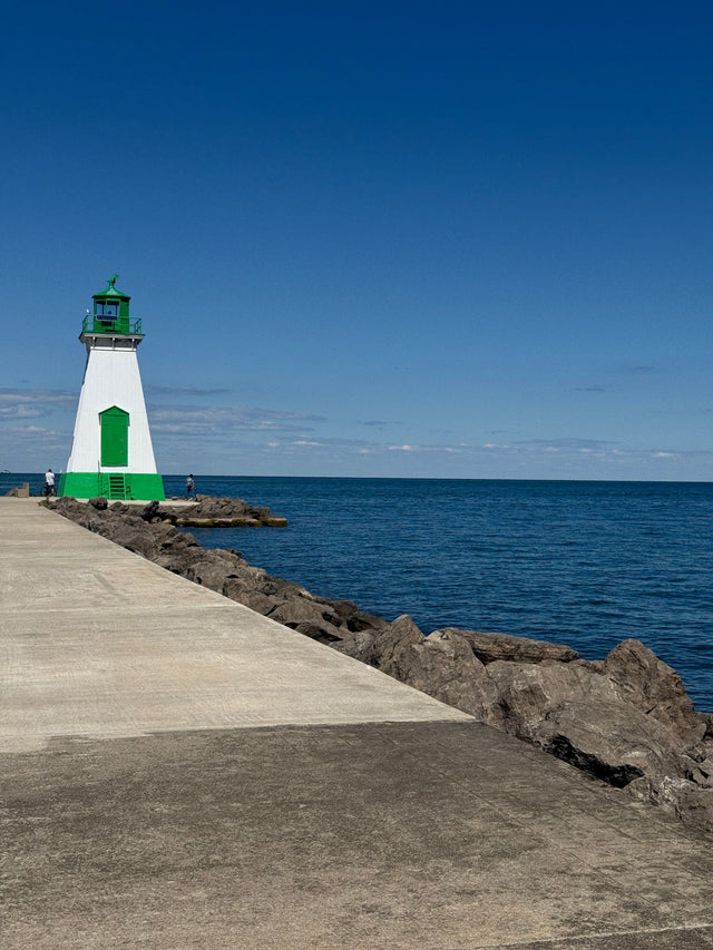Port Dalhousie Lighthouse on the Lake Ontario shore in St. Catharines under a clear blue sky