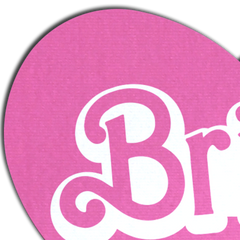 Close-up of pink heart pasty showing textured matte finish and white cursive Bride lettering