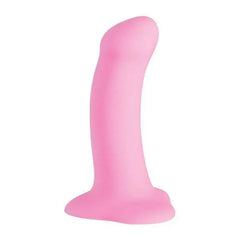 Pink silicone dildo in side view revealing smooth matte finish and flexible curved form