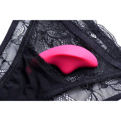 Pink silicone panty vibe nestled inside black lace underwear, discreet wearable design